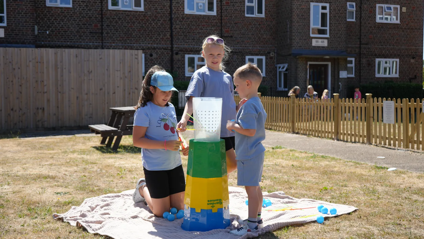 Children playing a garden game at the Nailsworth Crescent fun day in Merstham