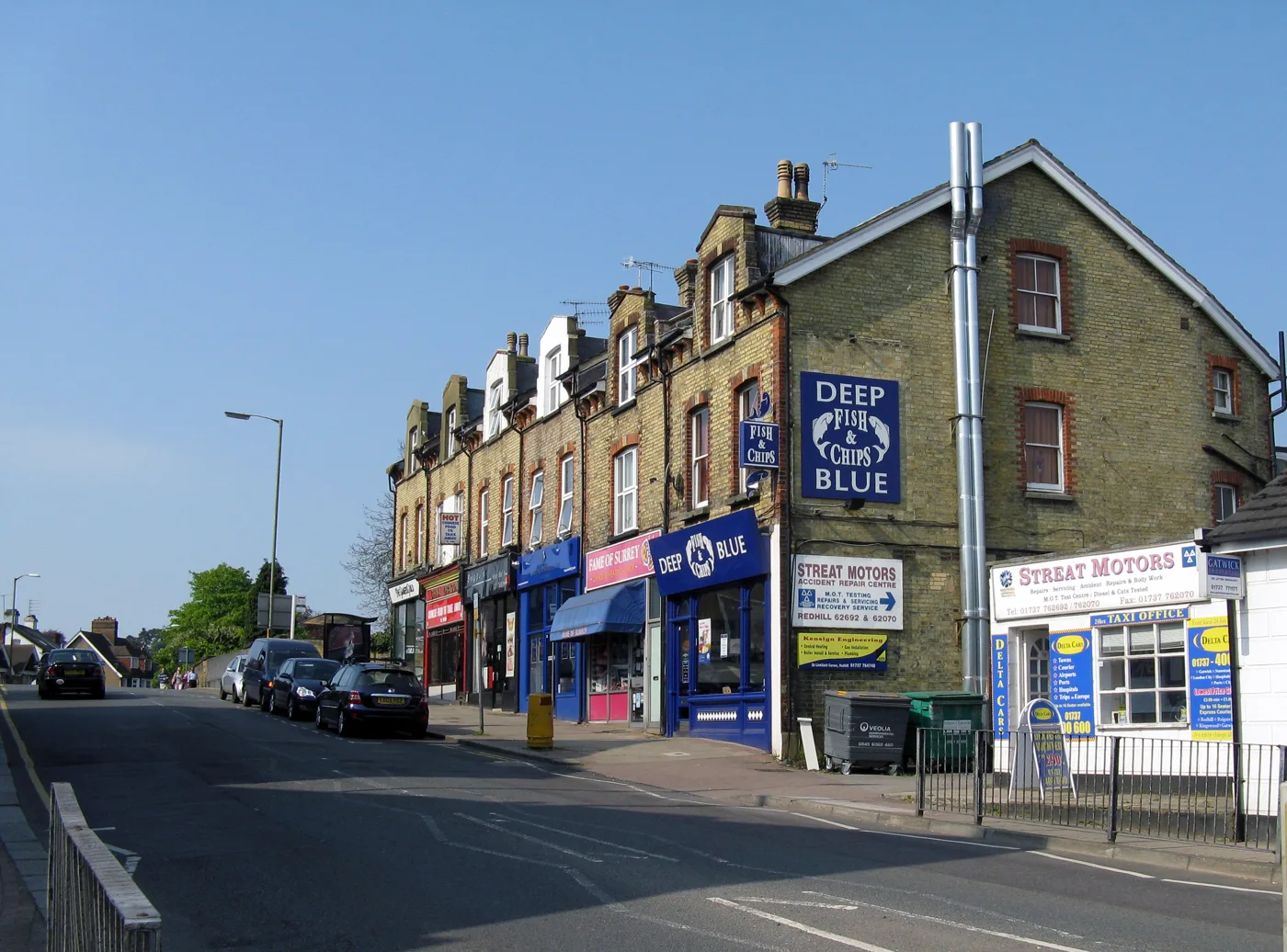 Shops on Hatchlands Road, Redhill. The claimant count is a borough-wide statistic and does not identify any individual, employer or business.